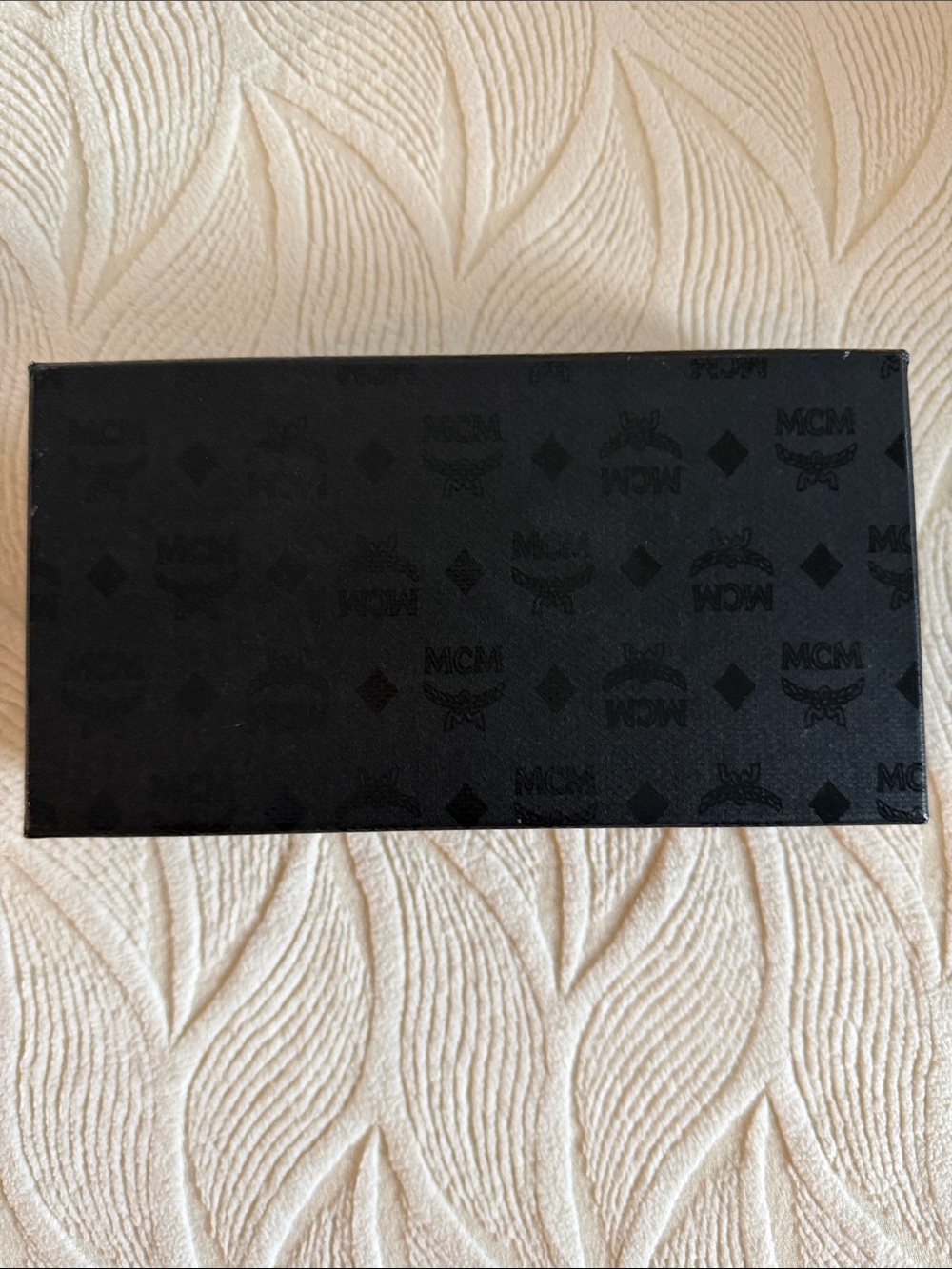 MCM Black Embossed Logo Clutch/Wallet display box with dust bag.